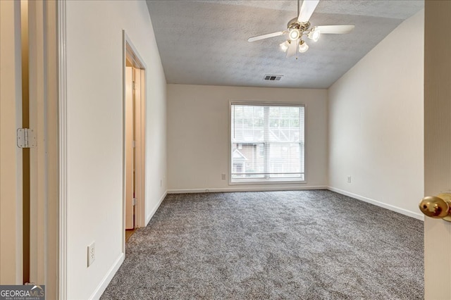 unfurnished bedroom with ceiling fan, a textured ceiling, and carpet flooring