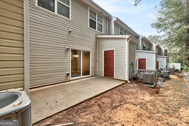 back of house featuring cooling unit and a patio area