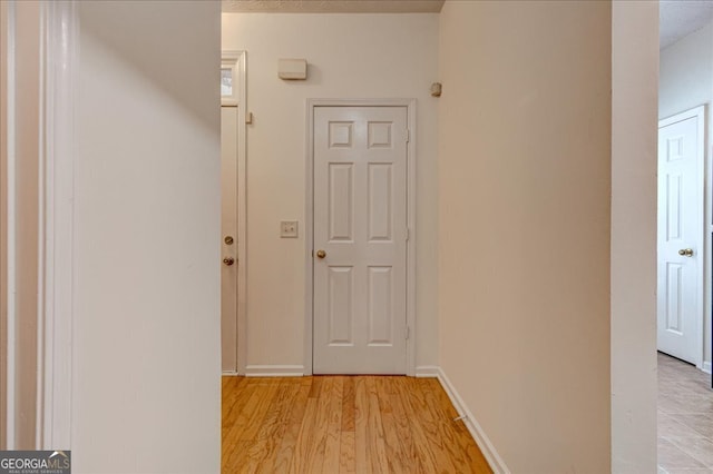 hallway featuring light hardwood / wood-style floors