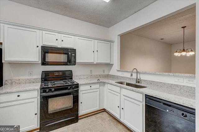 kitchen featuring an inviting chandelier, black appliances, sink, white cabinetry, and decorative light fixtures