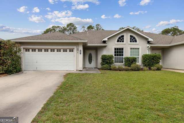 single story home with a garage and a front yard