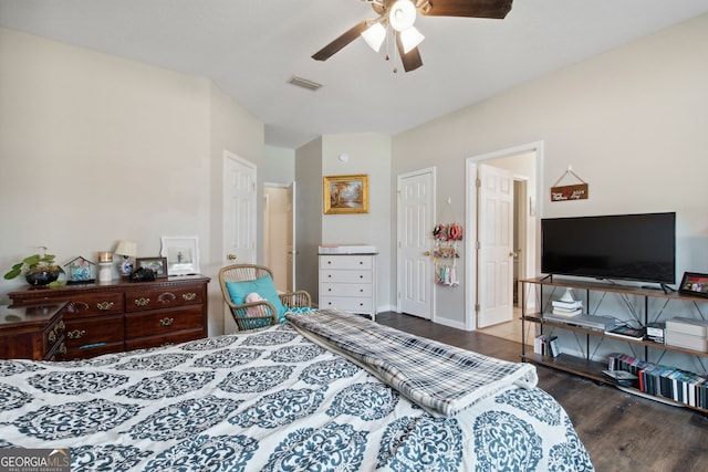 bedroom featuring dark hardwood / wood-style flooring and ceiling fan