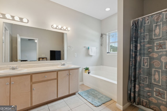 bathroom with vanity, tile patterned flooring, and a washtub