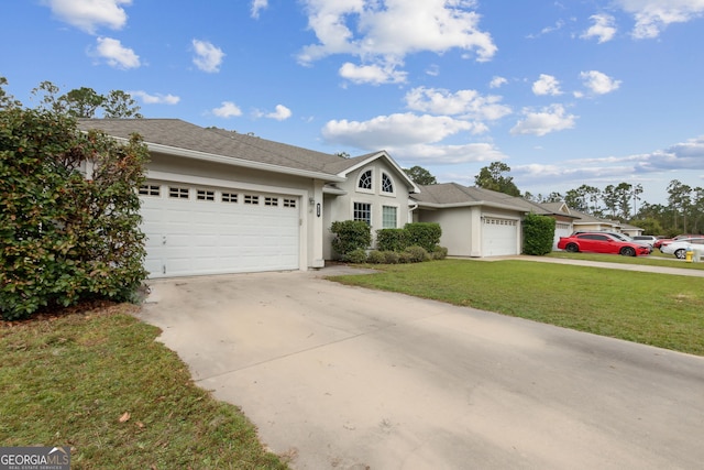 ranch-style home featuring a garage and a front yard