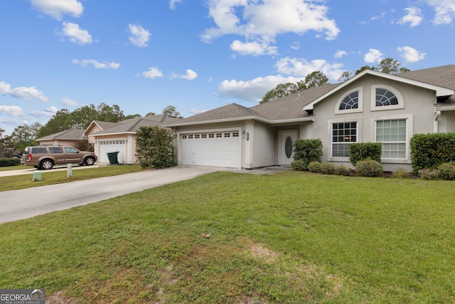 view of front of house with a garage and a front yard