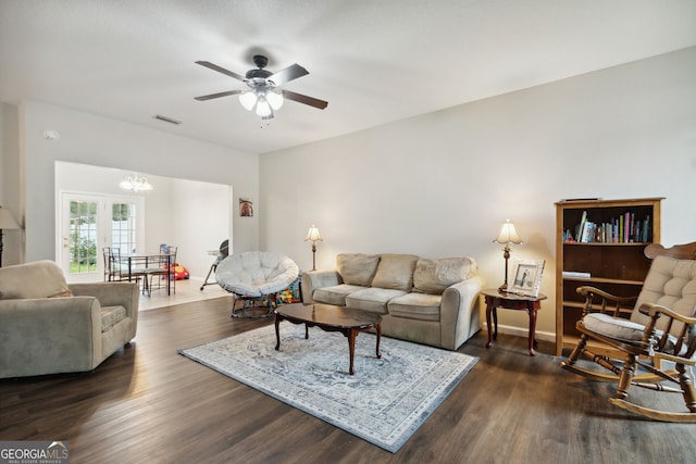 living room with french doors, dark hardwood / wood-style flooring, and ceiling fan