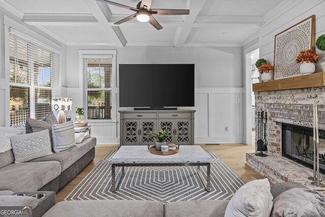 265 Federal St, Athens, GA 30607 - living area featuring wood finished floors, coffered ceiling, a decorative wall, beamed ceiling, and a fireplace