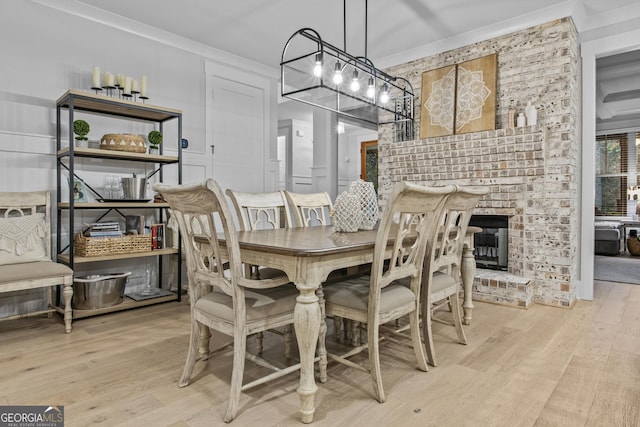 265 Federal St, Athens, GA 30607 - dining room featuring wood finished floors, ornamental molding, and a fireplace