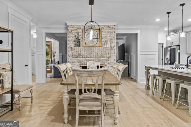 265 Federal St, Athens, GA 30607 - dining space with ornamental molding, a decorative wall, light wood-style flooring, and recessed lighting