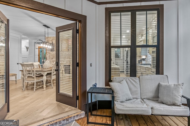 interior space featuring a notable chandelier and light hardwood / wood-style floors