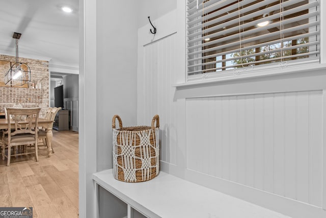 mudroom with light hardwood / wood-style floors