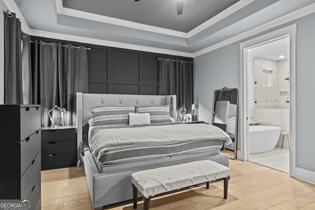 265 Federal St, Athens, GA 30607 - bedroom with a raised ceiling, light wood finished floors, ensuite bath, and ceiling fan