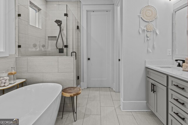 265 Federal St, Athens, GA 30607 - full bath featuring a stall shower, baseboards, vanity, and a freestanding bath
