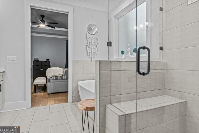 bathroom featuring ceiling fan, crown molding, independent shower and bath, tile walls, and hardwood / wood-style flooring