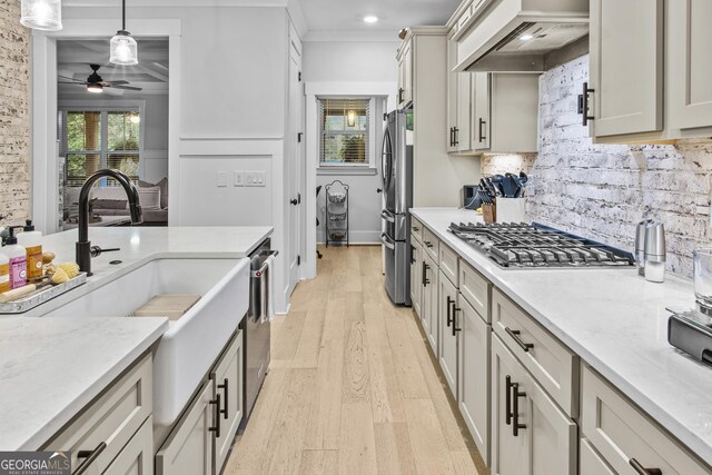 265 Federal St, Athens, GA 30607 - kitchen featuring appliances with stainless steel finishes, custom exhaust hood, ceiling fan, tasteful backsplash, and light wood finished floors