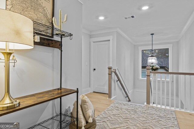 265 Federal St, Athens, GA 30607 - hallway featuring an upstairs landing, light wood-style flooring, ornamental molding, and recessed lighting