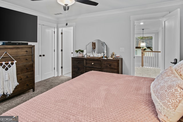 bedroom featuring carpet floors, ceiling fan, and ornamental molding