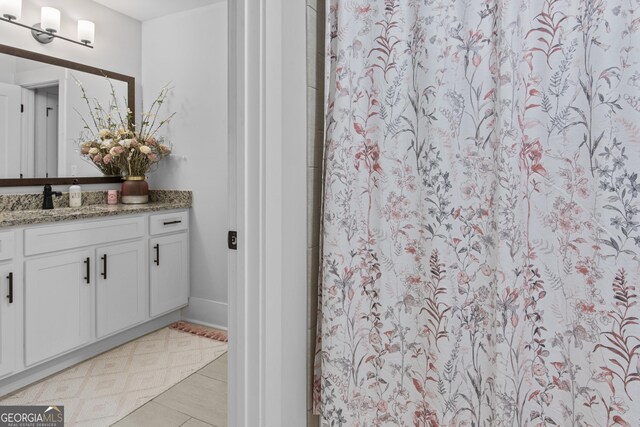 265 Federal St, Athens, GA 30607 - full bathroom with vanity, a shower with shower curtain, and tile patterned floors