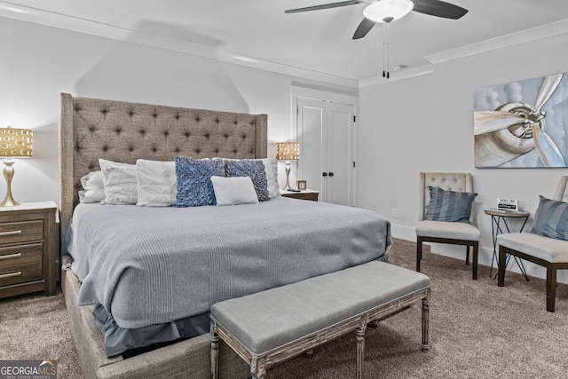 carpeted bedroom with ceiling fan and ornamental molding