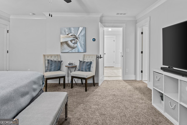 carpeted bedroom with ceiling fan and crown molding