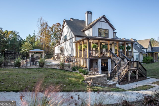 265 Federal St, Athens, GA 30607 - view of front facade with stairway, a porch, a chimney, and a ceiling fan