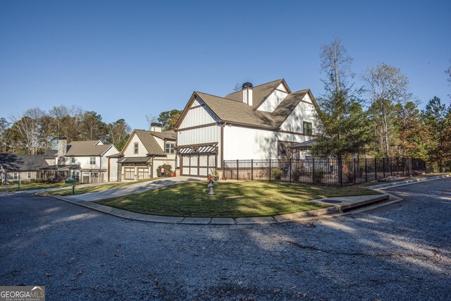 265 Federal St, Athens, GA 30607 - view of front of home with concrete driveway, a chimney, and a residential view