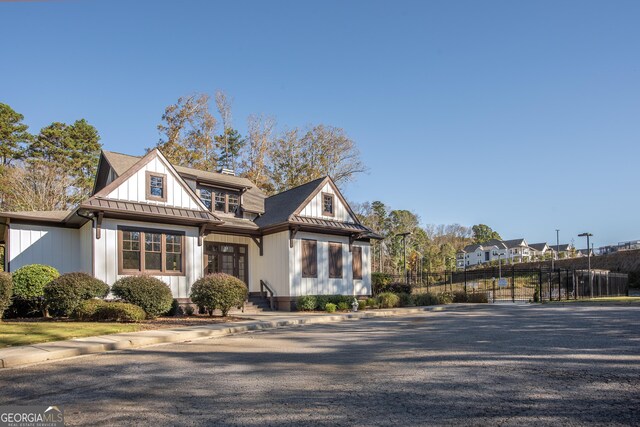 265 Federal St, Athens, GA 30607 - view of front of house with board and batten siding, fence, and a standing seam roof
