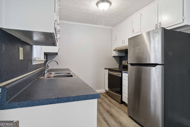 kitchen featuring white cabinetry, sink, appliances with stainless steel finishes, ornamental molding, and light wood-type flooring