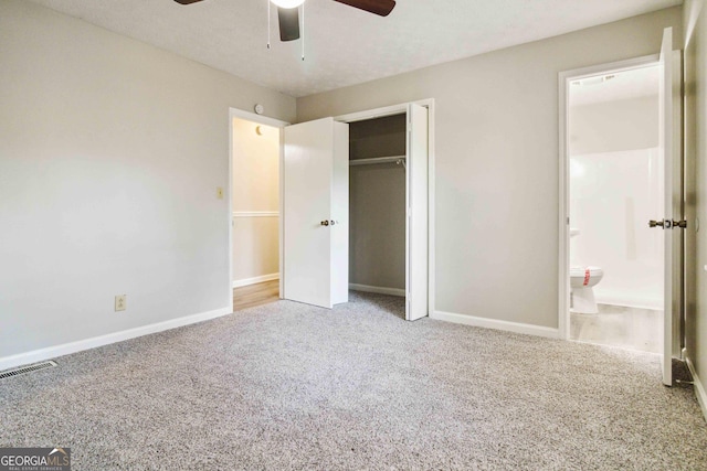 117 Neal Ave, Stockbridge, GA 30281 - unfurnished bedroom featuring carpet flooring, baseboards, a closet, connected bathroom, and a ceiling fan
