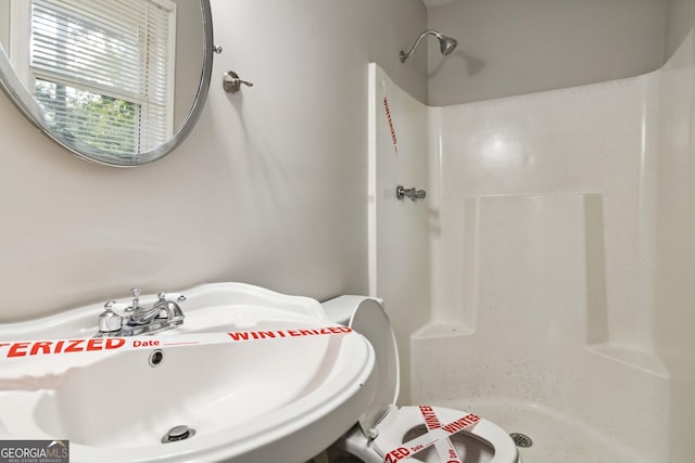 117 Neal Ave, Stockbridge, GA 30281 - bathroom with a shower stall and a sink