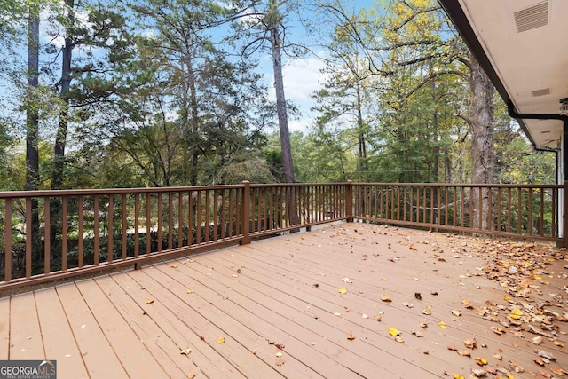 117 Neal Ave, Stockbridge, GA 30281 - wooden terrace with view of scattered trees