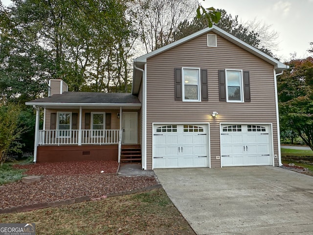 view of front facade featuring a garage and covered porch