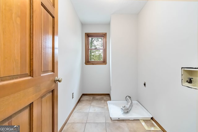 clothes washing area with washer hookup, light tile patterned floors, and hookup for an electric dryer