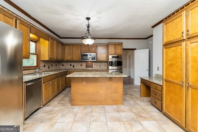 kitchen featuring tasteful backsplash, a kitchen island, appliances with stainless steel finishes, light stone countertops, and hanging light fixtures