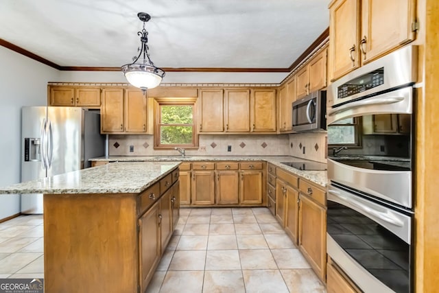 kitchen featuring hanging light fixtures, a wealth of natural light, appliances with stainless steel finishes, and tasteful backsplash