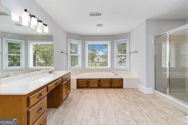 bathroom featuring vanity and separate shower and tub