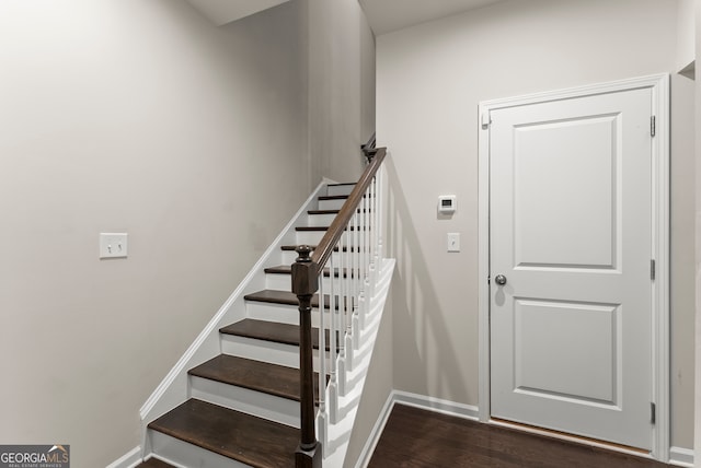 staircase featuring hardwood / wood-style floors