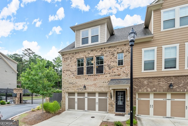 townhome / multi-family property featuring a garage