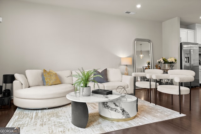 living room featuring dark hardwood / wood-style flooring