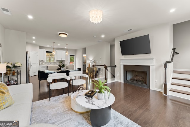 living room featuring dark wood-type flooring