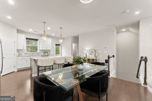 dining area featuring dark hardwood / wood-style flooring