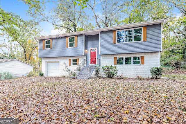 raised ranch featuring a garage