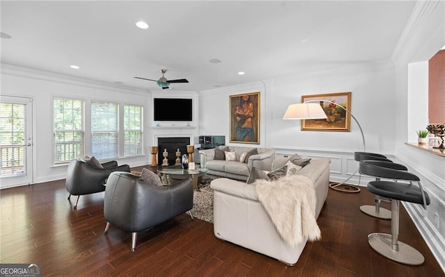 living room featuring dark hardwood / wood-style flooring and crown molding