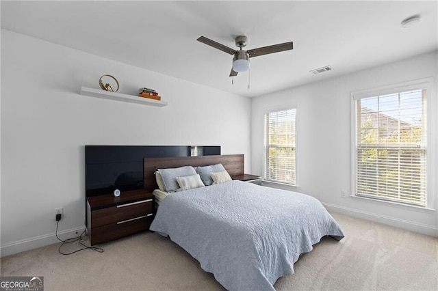 carpeted bedroom with ceiling fan