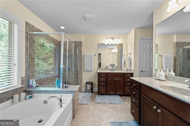 bathroom featuring vanity, tile patterned floors, and independent shower and bath