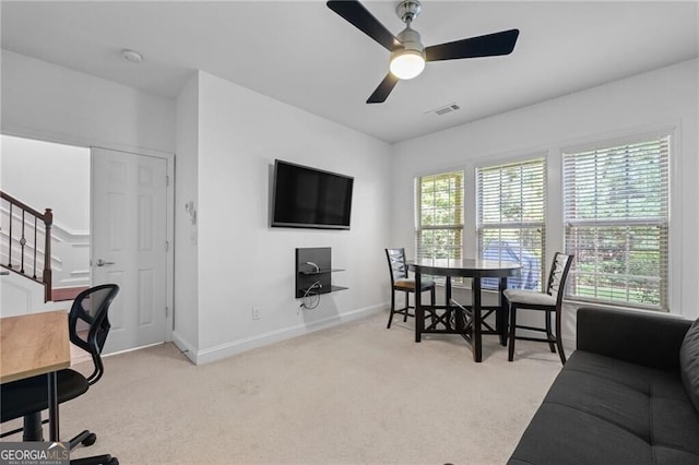 interior space featuring ceiling fan