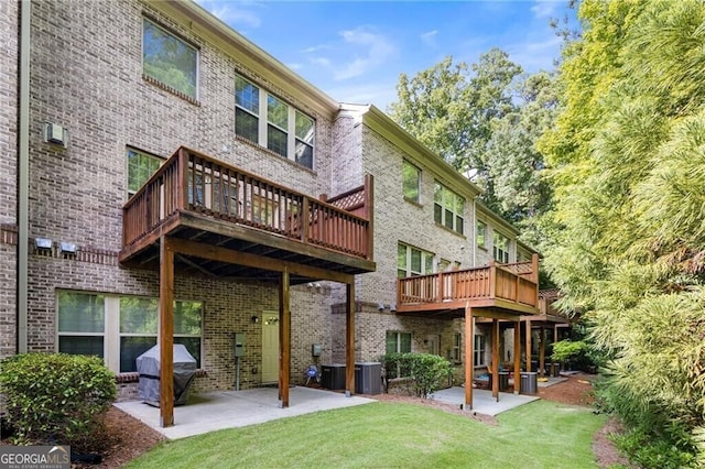 back of house featuring a yard and a patio