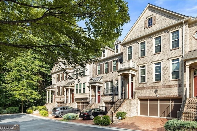 view of front of house with a garage and a balcony