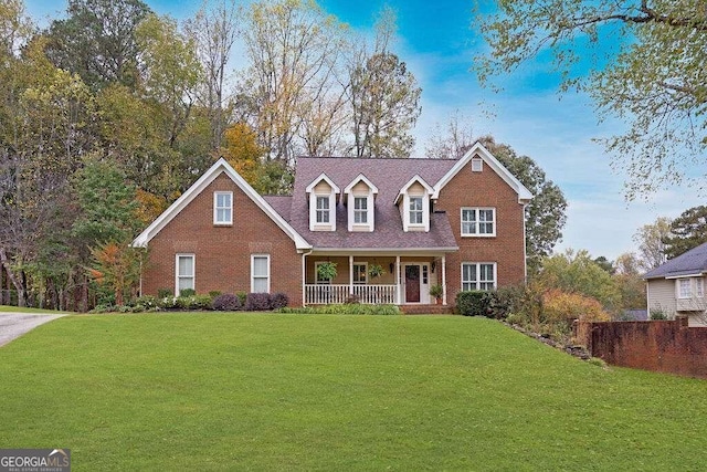 view of front of house featuring a porch and a front lawn