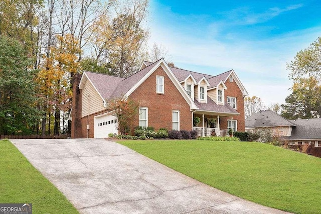 view of front facade featuring a front lawn, a garage, and a porch